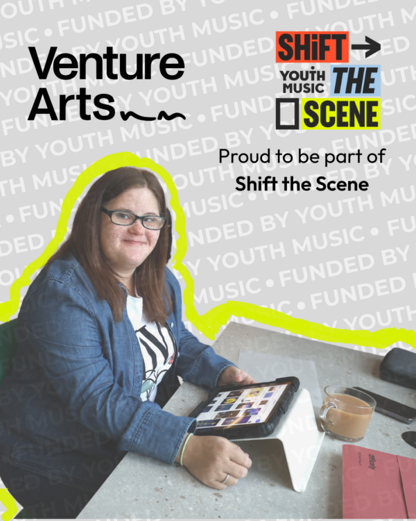 Venture Arts studio artist Nevaeh sits at a table with an eye pad smiling. She wears a white t-shirt with a blue denim shirt over the top, and she is wearing glasses. The Venture Arts logo is in the top right corner and the Shift the Scene is the top left corner. There is text below which reads 'Proud to be part of Shift the Scene'.
