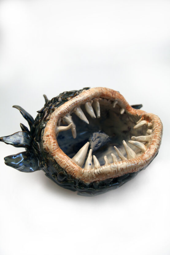 A ceramic piece created by Dominic Bennett - the large open mouth of a creature with lots of sharp teeth