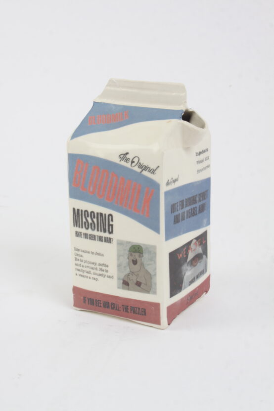 Ceramic milk carton with writing and pictures on labelled Bloodmilk