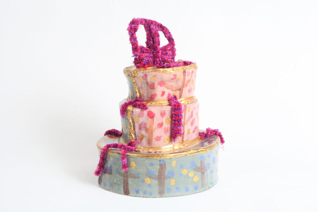Louise Hewitt, 'Willy Wonka Cake' - ceramic three tier cake, photographed at the Until It Looks Like This exhibition