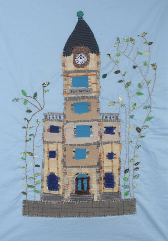 An textiles artwork of a clocktower on a light blue background by Venture Arts artist Chelsea Dalton.