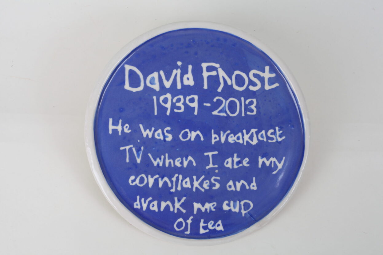 Ceramic blue plaque dedicated to David Frost, by Horace Lindezey