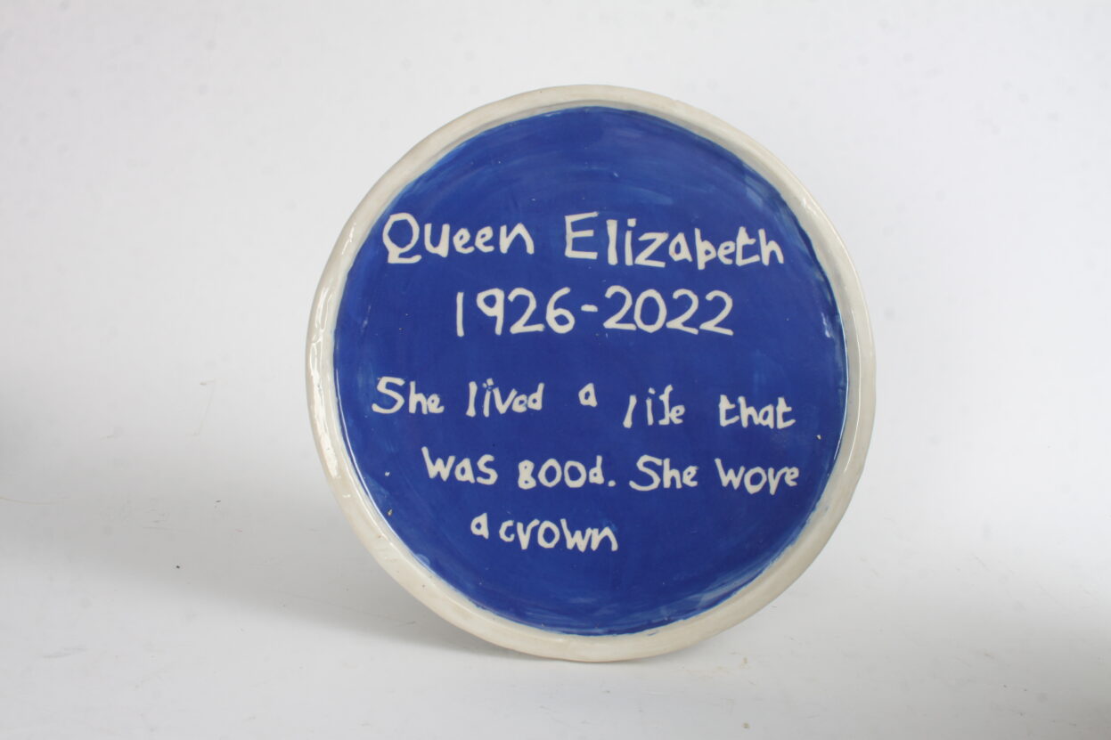 Ceramic blue plaque for the Queen.