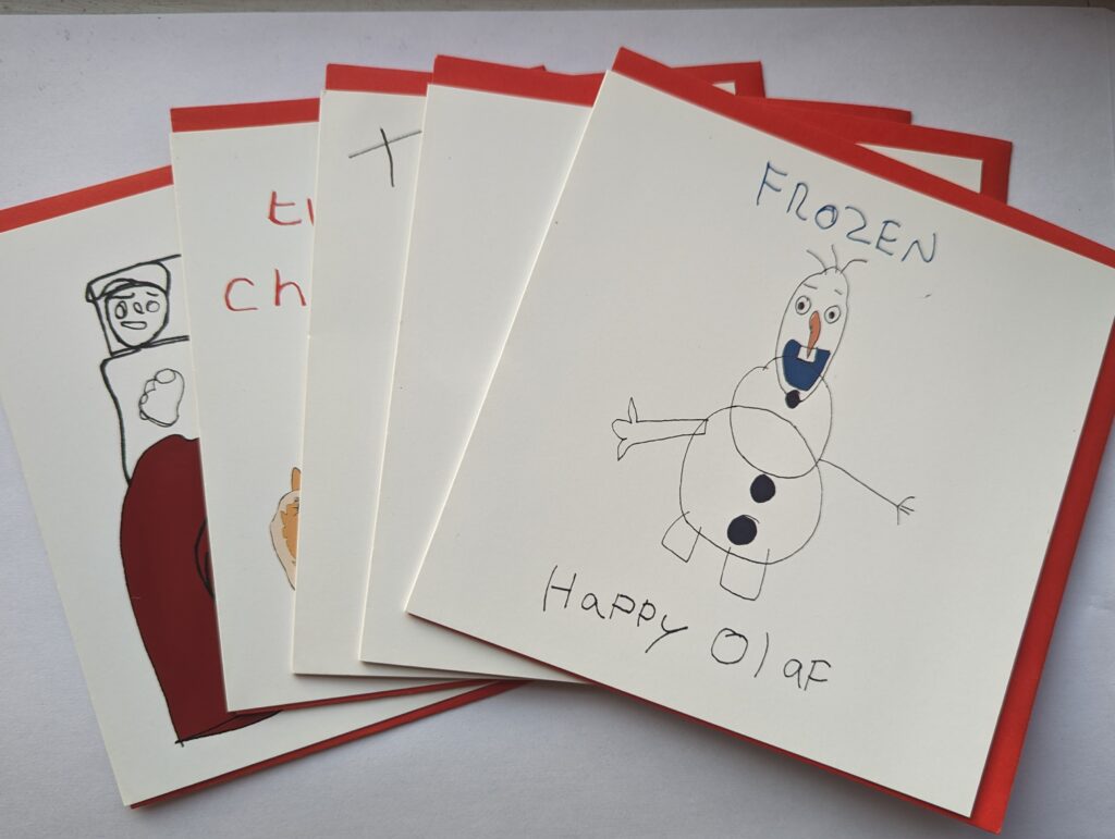 Collection of Christmas cards with red envelopes