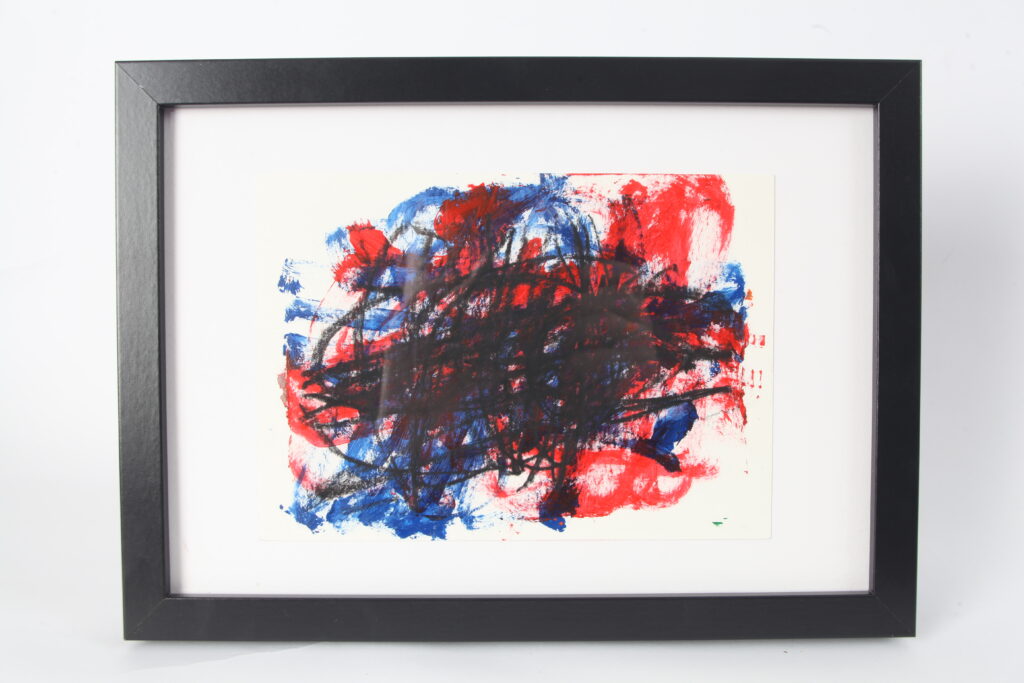 Abstract artwork in red, blue and black, on white background in black frame