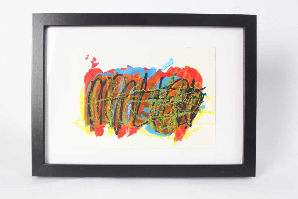 Abstract artwork in red, yellow, blue and black, on white background in black frame