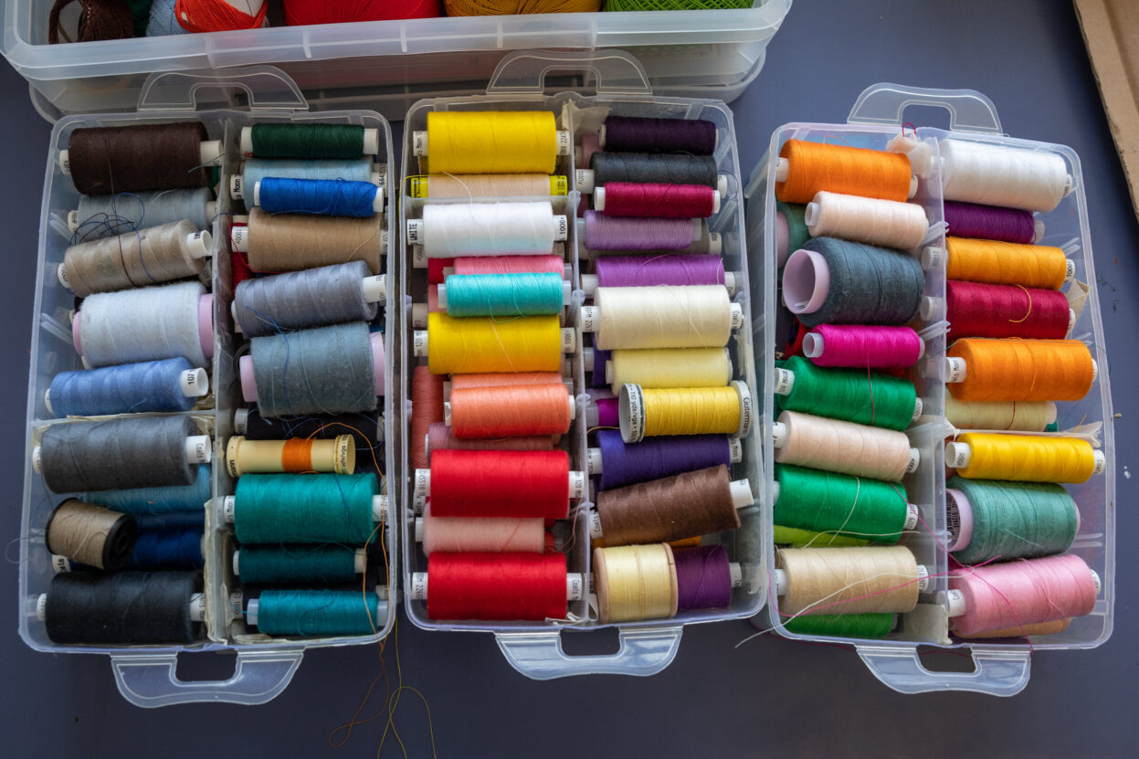 a box of colourful cotton thread.