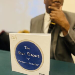 Artist Horace Lindezey with his art book The Blue Plaques