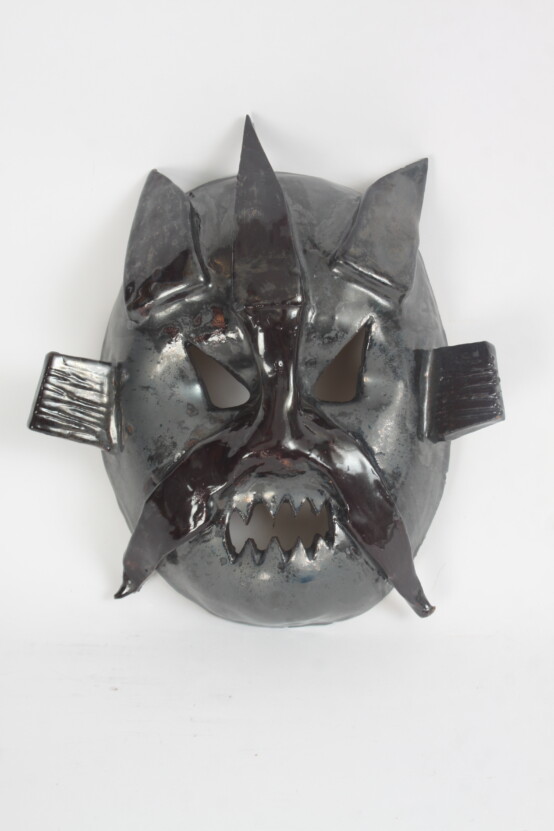 Black ceramic dragon mask.