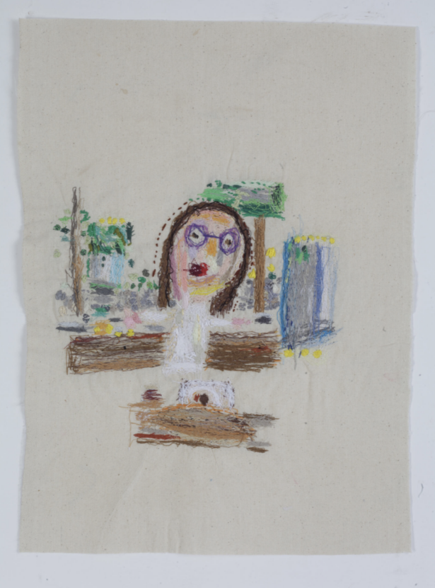 A piece of artwork by Chloe, Venture Arts studio artist. The artwork is of a person who looks like an angel, wearing white clothes with shoulder length brown hair. The piece has been created using hand and machine embroidery on fabric.