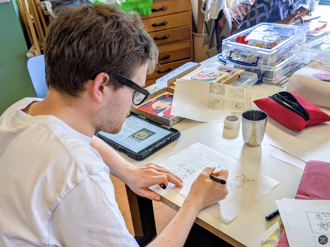 George drawing in the Venture Arts studio.